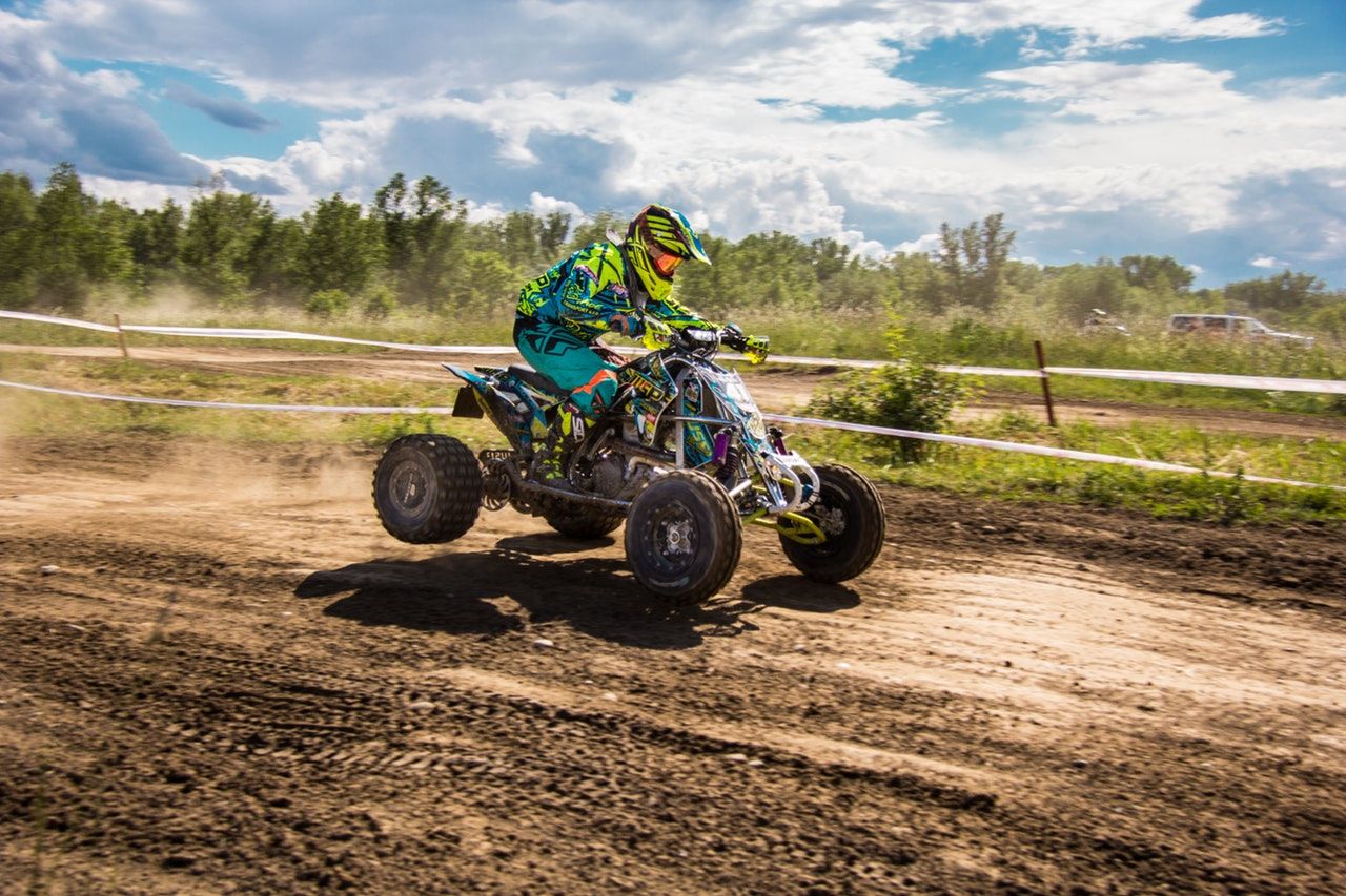 person riding an ATV on dirt