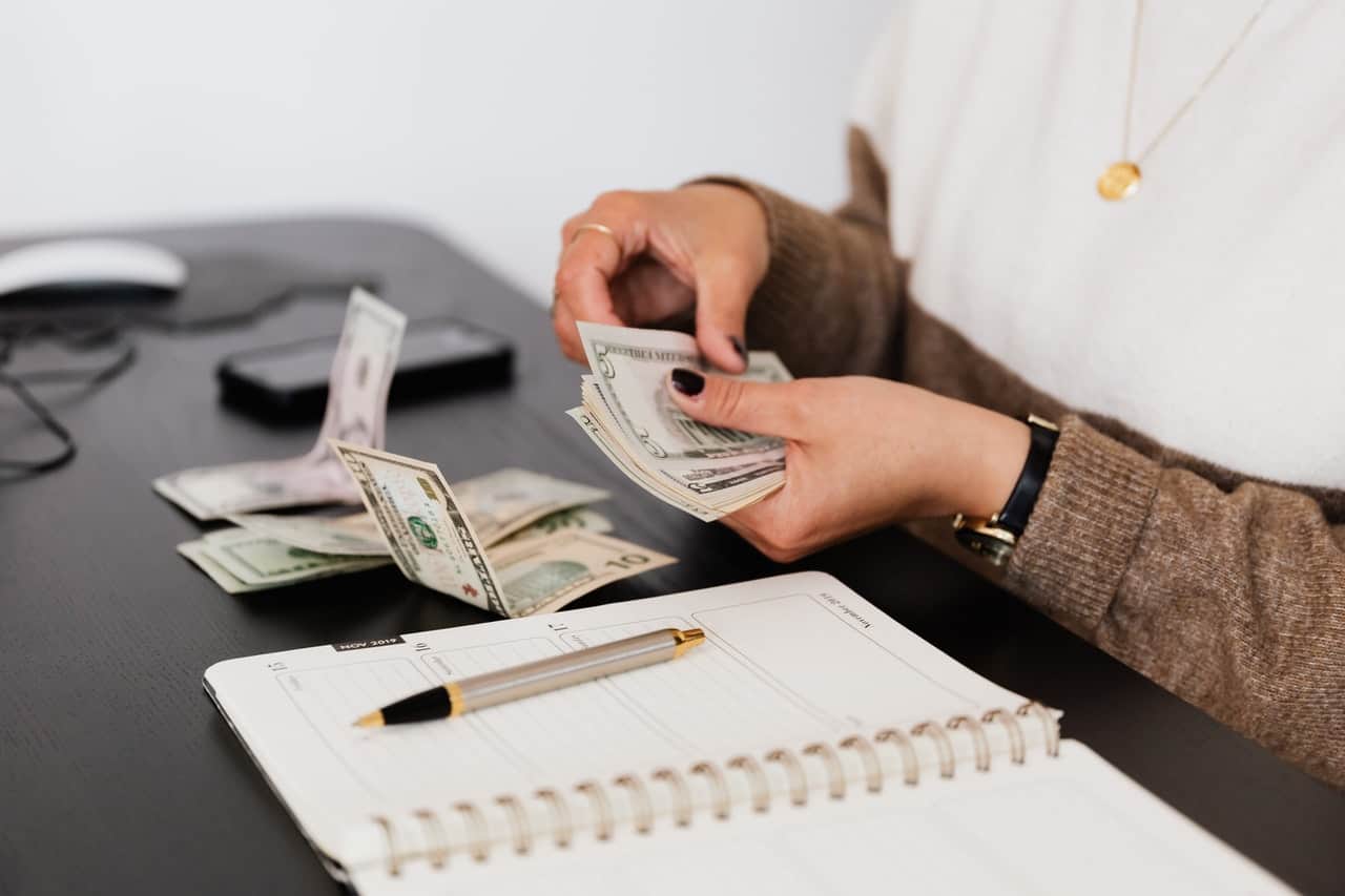 counting out cash at a table