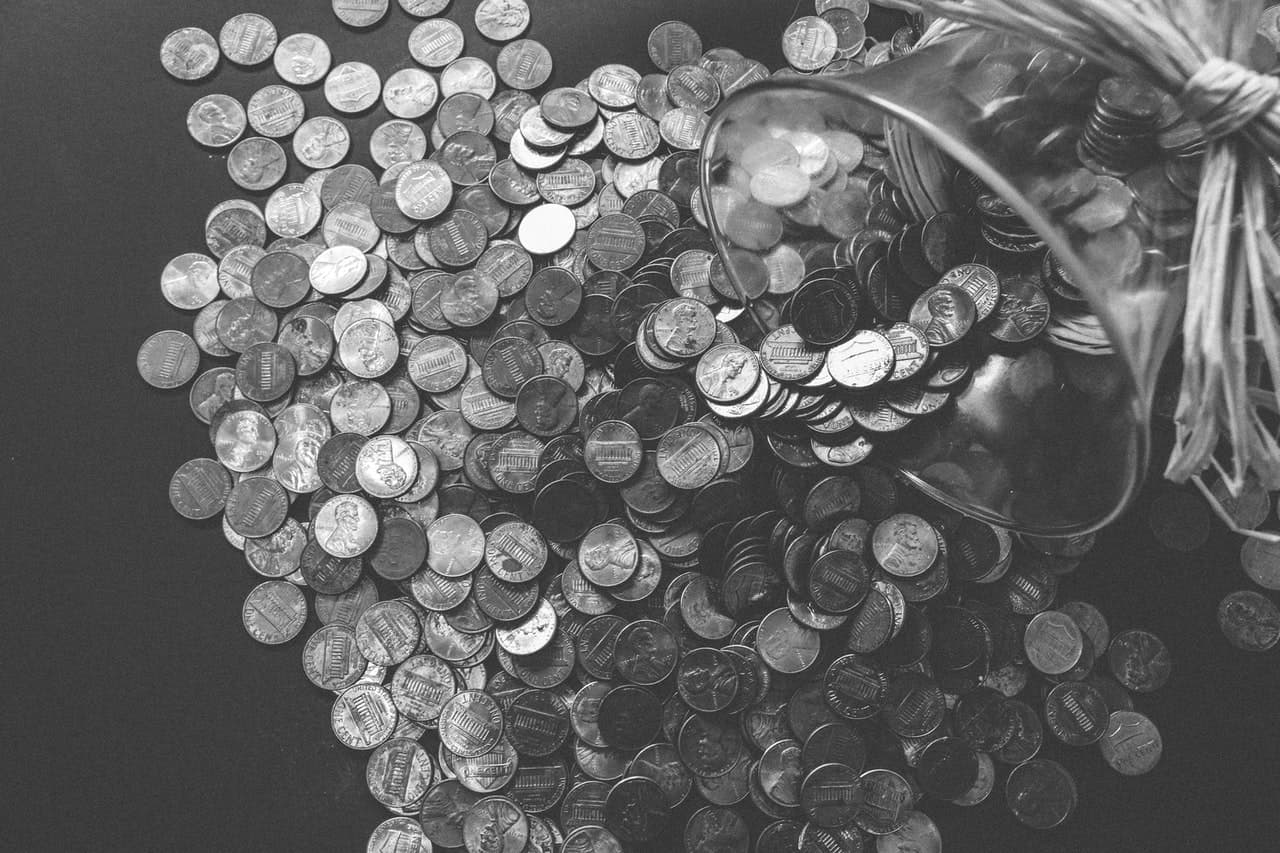 a lot of quarters poured out on a table